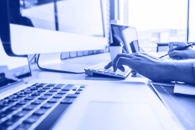 Person Typing on a Keyboard