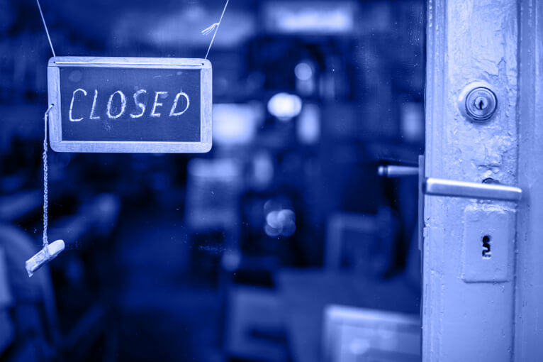 Blue Image of a Shop Door with a Closed Sign on